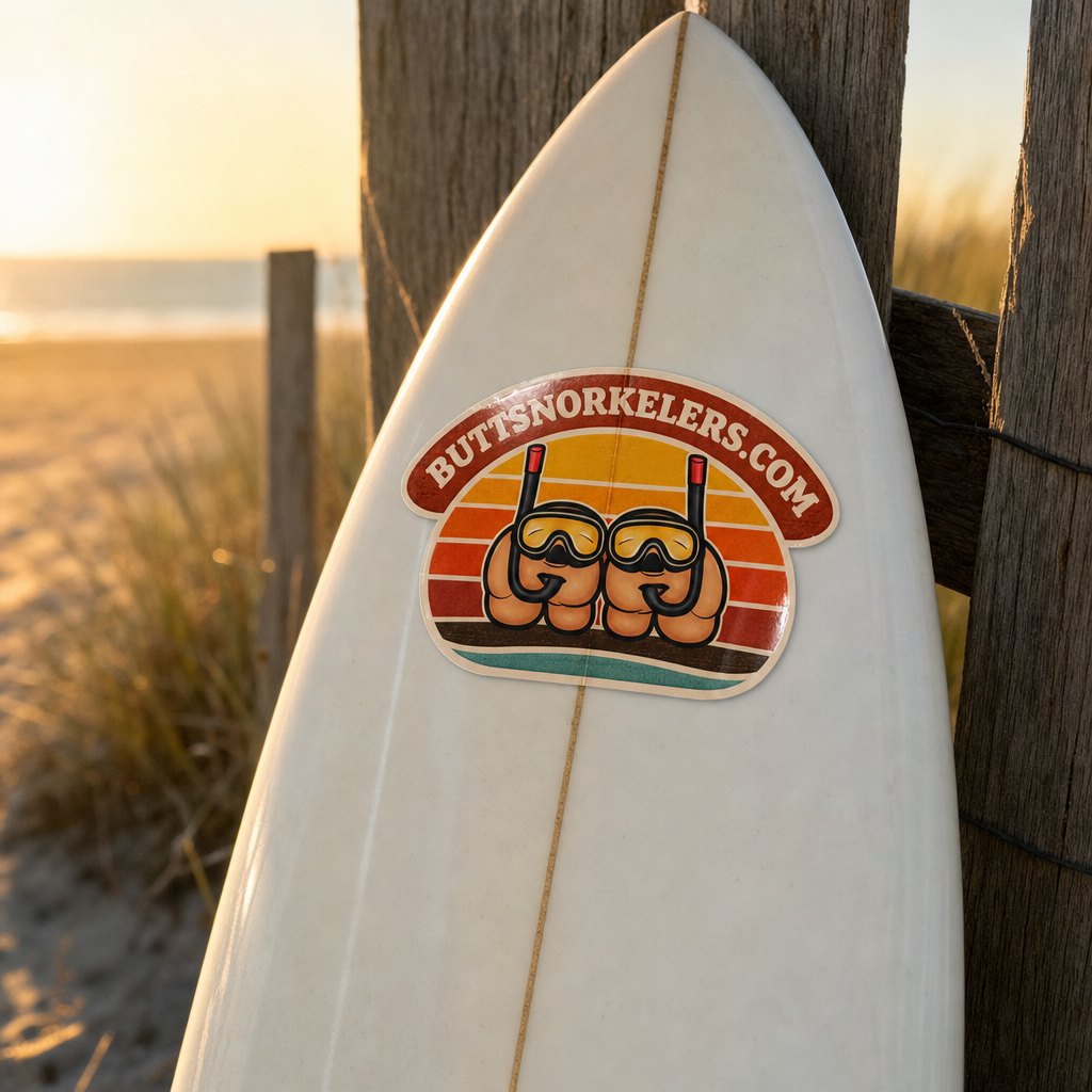 ButtSnorkelers sticker on the nose of a longboard at golden hour